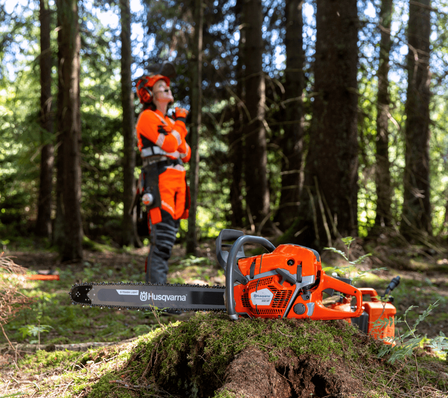 woman wearing range of personal protective equipment in forest